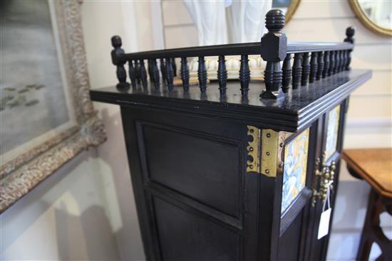 An Aesthetic movement ebonised music cabinet, in the manner of Morris & Co., W.30in.